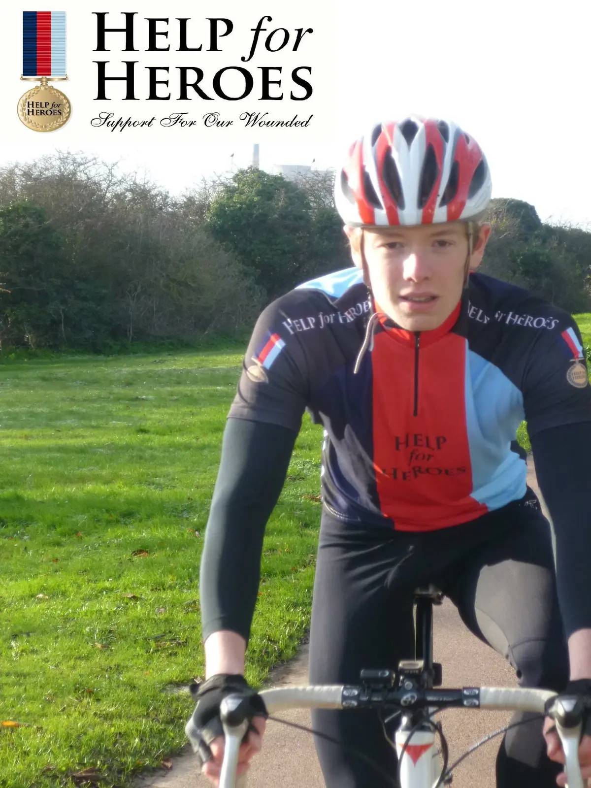Chris Fennell cycling in Help for Heroes kit during his endurance fundraising challenge