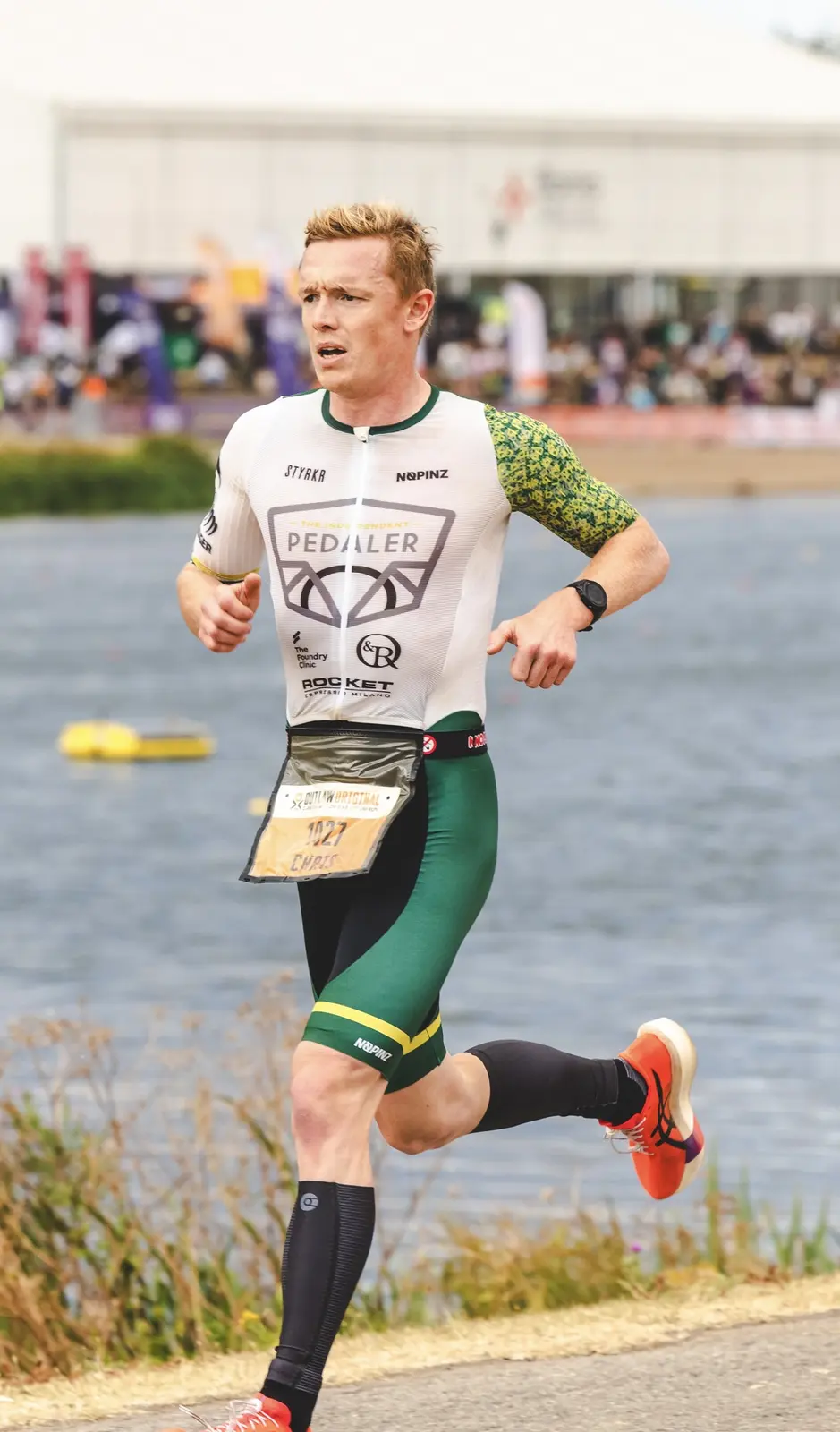 Dr Christopher Fennell running during triathlon competition